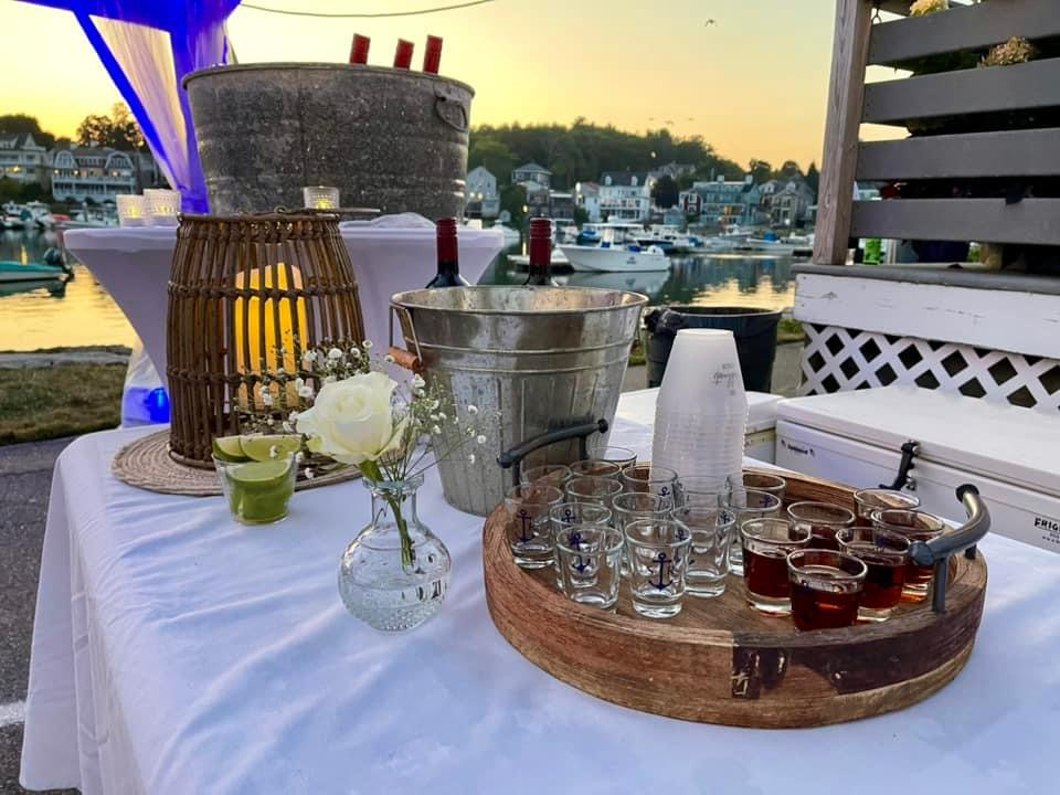 Outdoor seating beside Manchester Harbor
